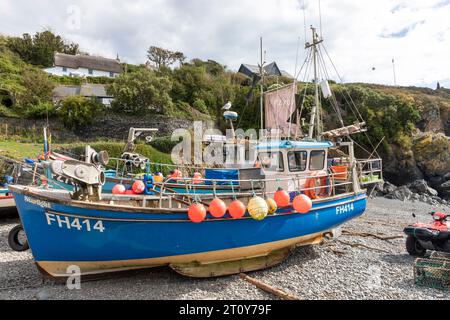 Fishing boat on the shingle beach at Cadgwith cove, Cornwall,England,UK Stock Photo
