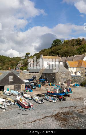 September 2023, Cadgwith village cove with commercial fishing boats on the shingle beach,Lizard Peninsula,Cornwall,England,UK Stock Photo