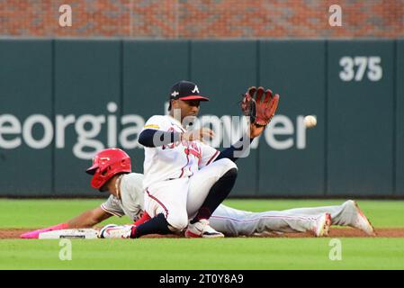 Atlanta, United States. 09th Oct, 2023. Philadelphia Phillies Johan Rojas slides safely into second base as Atlanta Braves second baseman Ozzie Albies waits for the throw after a wild pitch by Max Fried in the second inning in game two of an MLB National League Division Series in Truist Park in Atlanta on Monday, October 9, 2023. Photo by Scott Cunningham/UPI. Credit: UPI/Alamy Live News Stock Photo