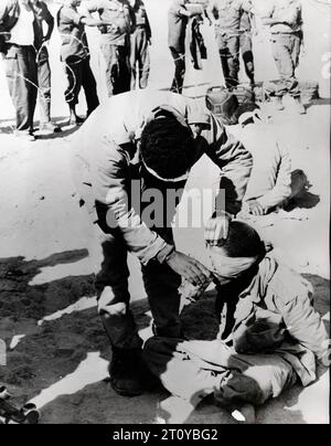 Nov 2, 1973; Cairo, Egypt; The 1973 Yom Kippur War started when Egypt and Syria suprise attacked in Sinai and Golan Heights, pictured is an Egyptian prisoner giving water to a comrade. (Credit Image: © Keystone Press Agency/ZUMA Press Wire) EDITORIAL USAGE ONLY! Not for Commercial USAGE! Stock Photo