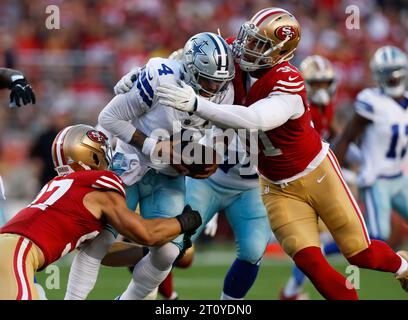 Santa Clara, United States. 08th Oct, 2023. San Francisco 49ers' Nick Bosa (97) and Arik Armstead (91) sack Dallas Cowboys starting quarterback Dak Prescott (4) in the first quarter at Levi's Stadium in Santa Clara, California on Sunday, Oct. 8, 2023. (Photo by Nhat V. Meyer/Bay Area News Group/TNS/Sipa USA) Credit: Sipa USA/Alamy Live News Stock Photo