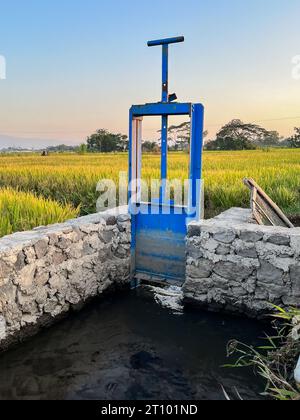 sluice gate or water gate useful for regulating water discharge Stock Photo