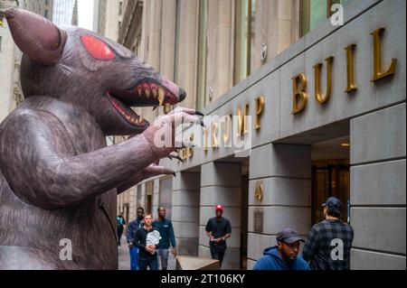 Giant inflatable rat in front of Trump Building Manhattan NYC closeup Stock Photo