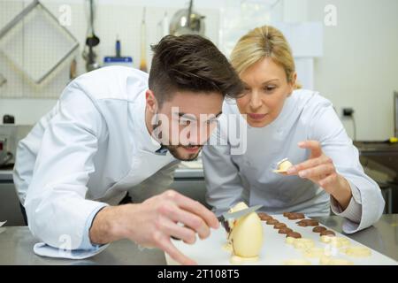 doing chocolate egg design Stock Photo