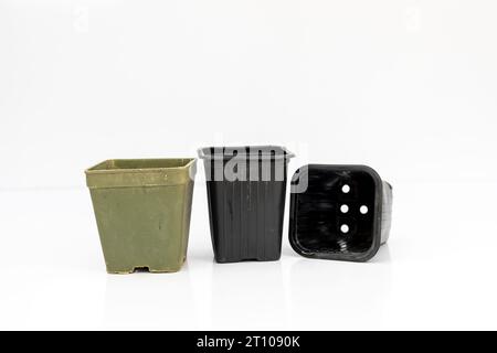 Plastic pots and containers for nursery and garden on white isolated background Stock Photo