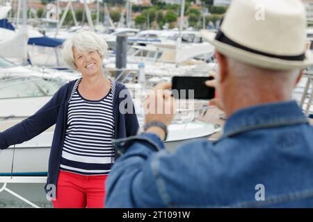 senior couple taking photos during holidays Stock Photo