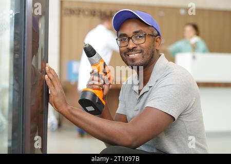 male handyman using cordless drill Stock Photo