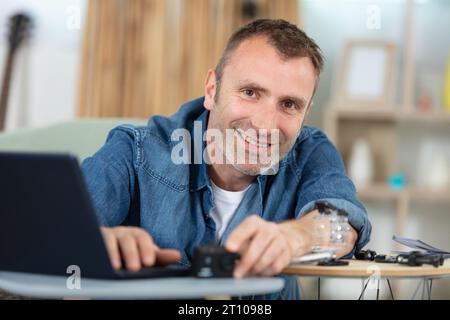 portrait of smiling male photo editor using computer Stock Photo