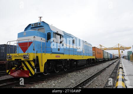 (231010) -- BEIJING, Oct. 10, 2023 (Xinhua) -- This photo taken on May 19, 2022 shows a freight train arriving at the dry port in the Horgos-Eastern Gate special economic zone bordering Kazakhstan and China. In 2013, China proposed the idea of building an 'economic belt along the Silk Road' in Kazakhstan, which, combined with the proposal of the 21st Century Maritime Silk Road, eventually became the Belt and Road Initiative (BRI).The China-Kazakhstan (Lianyungang) logistics cooperation base, launched in 2014, is the first entity project under the BRI. Acting as a dry port in the Horgos-Eastern Stock Photo