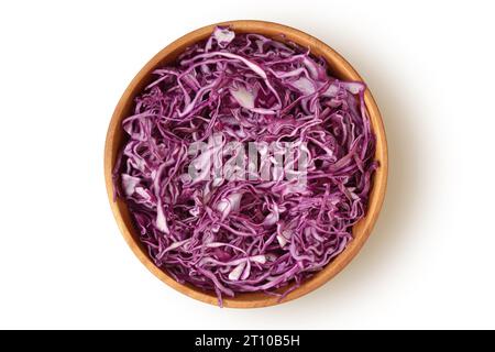 Raw sliced red cabbage in wooden bowl on white background Stock Photo