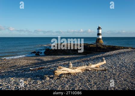 Penmon Point on the coast of Anglesey, North Wales. The famous Trwyn Du Lighthouse in morning sunlight. Stock Photo