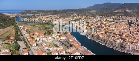 Panoramic drone point of view of the Italian town of Bosa and the Temo River that runs to Bosa Marina, a tourist destination on the island of Sardinia Stock Photo