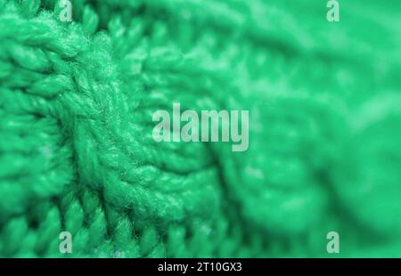 Closeup of the Pattern and Texture of Shamrock Green Knitted Wool Fabric Stock Photo