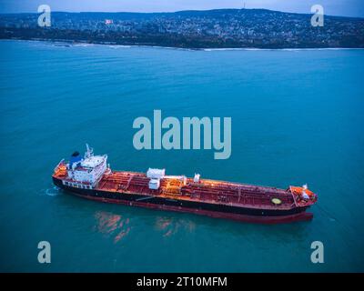 Aerial top view oil ship tanker carrier oil on the sea at sunrise Stock Photo