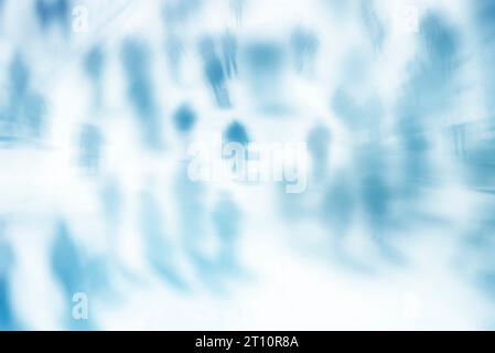 blur abstract people in motion background, unrecognizable silhouettes of people walking on a street. Stock Photo