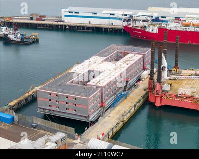 Portland, Dorset, UK.  10th October 2023.  General view from the air of the empty Bibby Stockholm immigration barge at Portland Port near Weymouth in Dorset.  Letters have been sent out to asylum seekers informing them that they will be relocated to the barge on Thursday 19th October 2023.  The barge was evacuated two months ago due the discovery of Legionella bacteria in the water.   Picture Credit: Graham Hunt/Alamy Live News Stock Photo