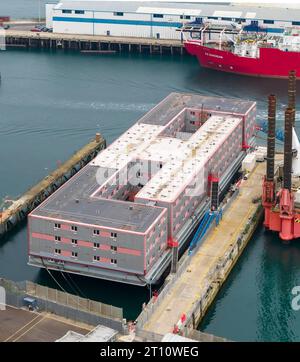 Portland, Dorset, UK.  10th October 2023.  General view from the air of the empty Bibby Stockholm immigration barge at Portland Port near Weymouth in Dorset.  Letters have been sent out to asylum seekers informing them that they will be relocated to the barge on Thursday 19th October 2023.  The barge was evacuated two months ago due the discovery of Legionella bacteria in the water.   Picture Credit: Graham Hunt/Alamy Live News Stock Photo