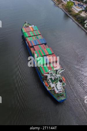 Aerial top view container ship, logistics import export, shipping or transportation concept background. Stock Photo