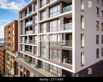 Aerial view of a modern apartment complex with colorful facades, flat ...