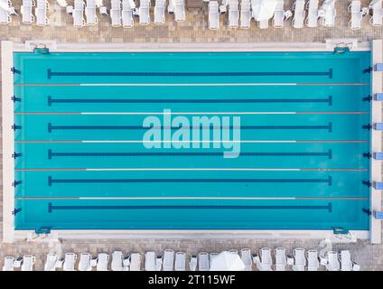 Aerial top down view on empty swimming pool in hotel, no people Stock Photo