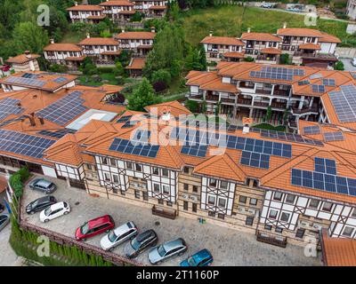 Luxury hotel With Solar Panels on the roof, aerial top down view Stock Photo