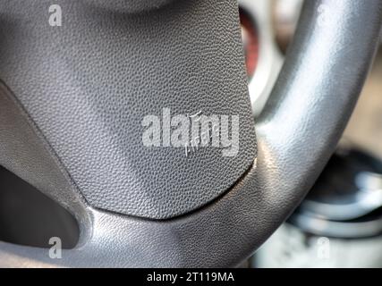 Airbag sign and text on the car steering wheel Stock Photo