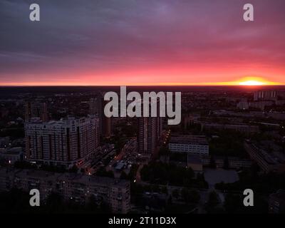 the city of kharkiv against the background of a red sunset sky aerial drone view Stock Photo