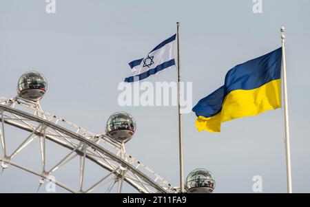 London, UK. 10th Oct, 2023. Ukrainian and Israeli flags fly from the roofs in Downing Street, both countries being at war. The London Eye/Millennium Wheel behind. Credit: Phil Robinson/Alamy Live News Stock Photo