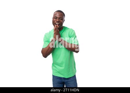 young charismatic energetic american guy promoter laughs and smiles on a white background with copy space Stock Photo