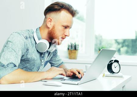 Photographer selecting photos on his computer Stock Photo