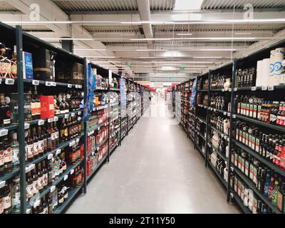 Shopping aisle in a supermarket with only alcoholic beverages. Stock Photo