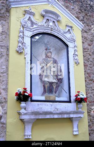 the statue of Martyr Saint George, protector and defender of Portugal, near the Arco do Castelo gateway Stock Photo