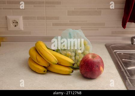 Kitchen Scene with Bananas and Mixed Fruits Stock Photo
