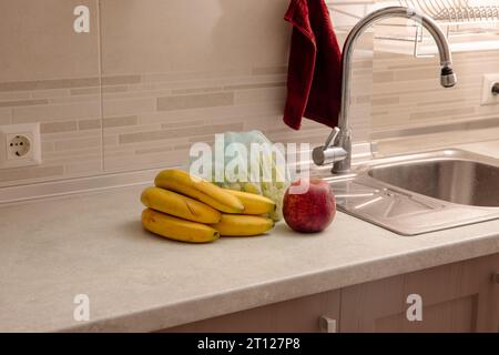 Kitchen Scene with Bananas and Mixed Fruits Stock Photo