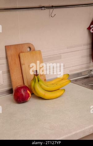 Kitchen Scene with Bananas and Mixed Fruits Stock Photo