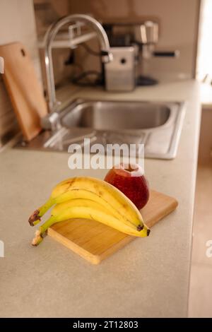Kitchen Scene with Bananas and Mixed Fruits Stock Photo