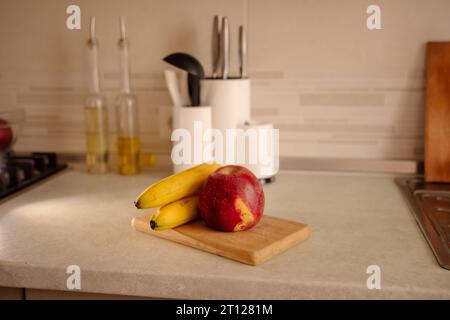 Kitchen Scene with Bananas and Mixed Fruits Stock Photo