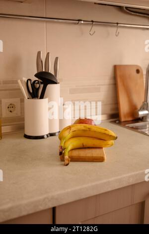 Kitchen Scene with Bananas and Mixed Fruits Stock Photo