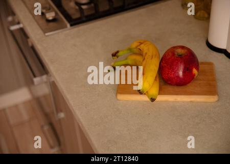 Kitchen Scene with Bananas and Mixed Fruits Stock Photo