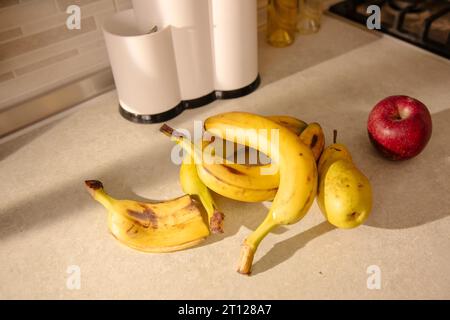 Kitchen Scene with Bananas and Mixed Fruits Stock Photo