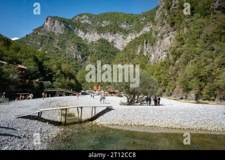 A wooden bridge over water at the River Shala resort village on Lake Komani, northern Albania Stock Photo