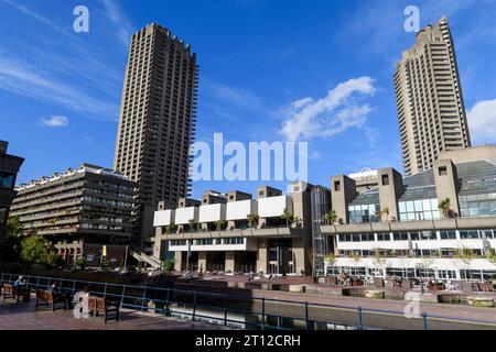 A view across the lake in front of the Barbican Centre, the apartment blocks in the background are the Shakespeare Tower on the left and the Cromwell Stock Photo