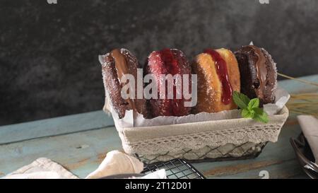 Bolas de Berlim, or "Berlin Balls". Portuguese fried dough with sugar, Filled with sweet cream. Stock Photo