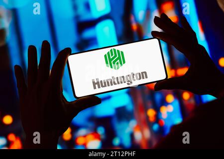 In this photo illustration, the Huntington Bank logo is displayed on a smartphone screen. Stock Photo