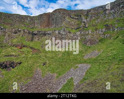 Colonnades of columnar jointing in basalt with fallen scree below at Giant's Causeway on the Antrim Coast of Northern Ireland, UK. Stock Photo