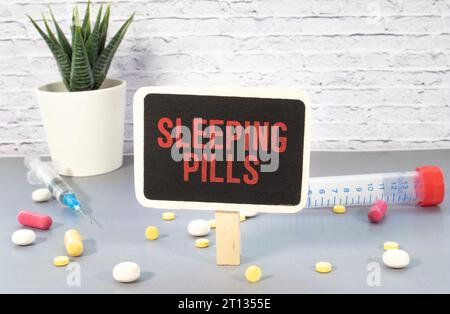 SLEEPING PILLS text on a letterhead in a medical folder on a beautiful background. Stock Photo