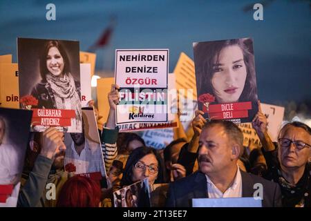 Istanbul, Turkey. 10th Oct, 2023. Demonstrators chant slogans, hold placards and portraits of the victims of the 2015 twin suicide bombings in Ankara, during a commemoration ceremony. Demonstrators gather at Kadikoy pier in Istanbul to attend a commemoration ceremony to pay tribute to the 104 victims of the twin bombings near Ankara train station on its 8th anniversary in Istanbul. Credit: SOPA Images Limited/Alamy Live News Stock Photo