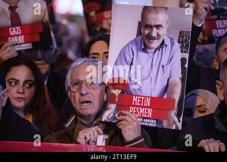 Istanbul, Turkey. 10th Oct, 2023. A protester chants slogans while holding a portrait of one of the victims of the 2015 double suicide attacks in Ankara. Demonstrators gather at Kadikoy pier in Istanbul to attend a commemoration ceremony to pay tribute to the 104 victims of the twin bombings near Ankara train station on its 8th anniversary in Istanbul. Credit: SOPA Images Limited/Alamy Live News Stock Photo