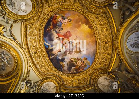 Ceiling art of Louvre museum. Image of artwork and painting on the ceiling at Louvre Museum, Paris, France. Louvre interior. Stock Photo