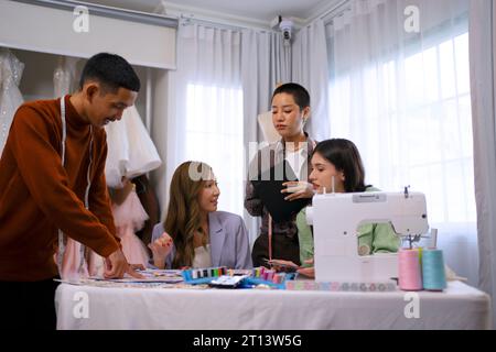 Designers work together at studio. Business, entrepreneur and designer concept. Stock Photo